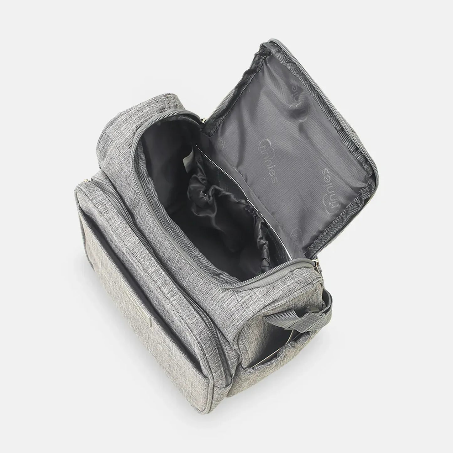 Gray toiletry bag with open lid on a white background