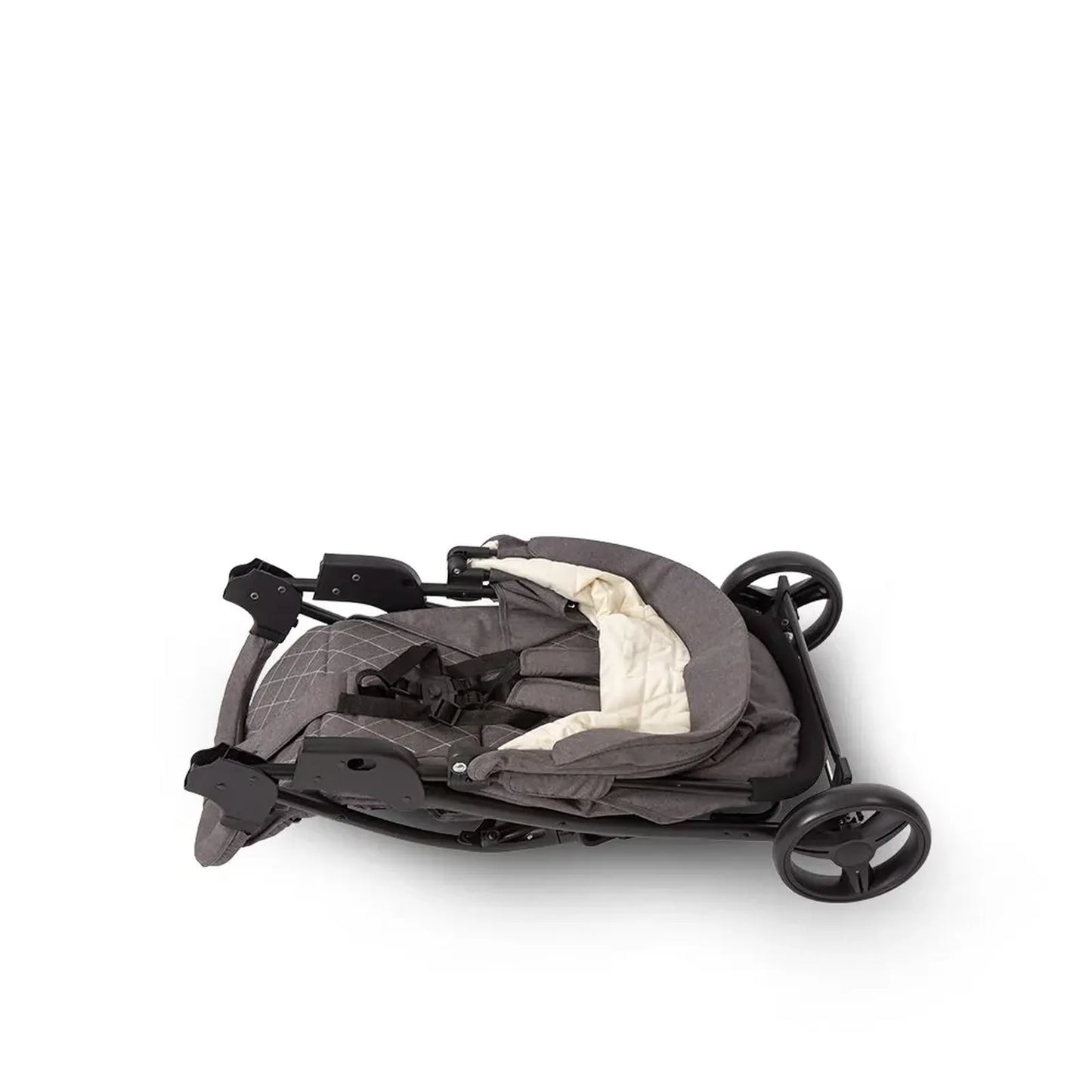 Folded baby stroller on a white background