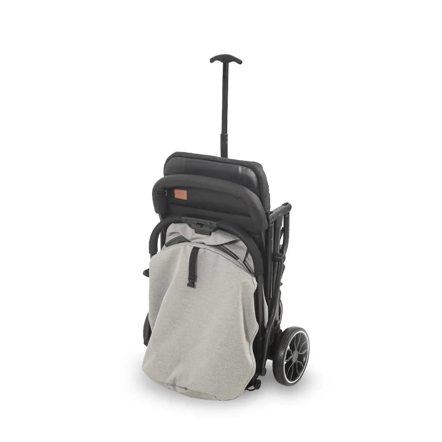 Black and gray stroller with a backpack attachment on a white background