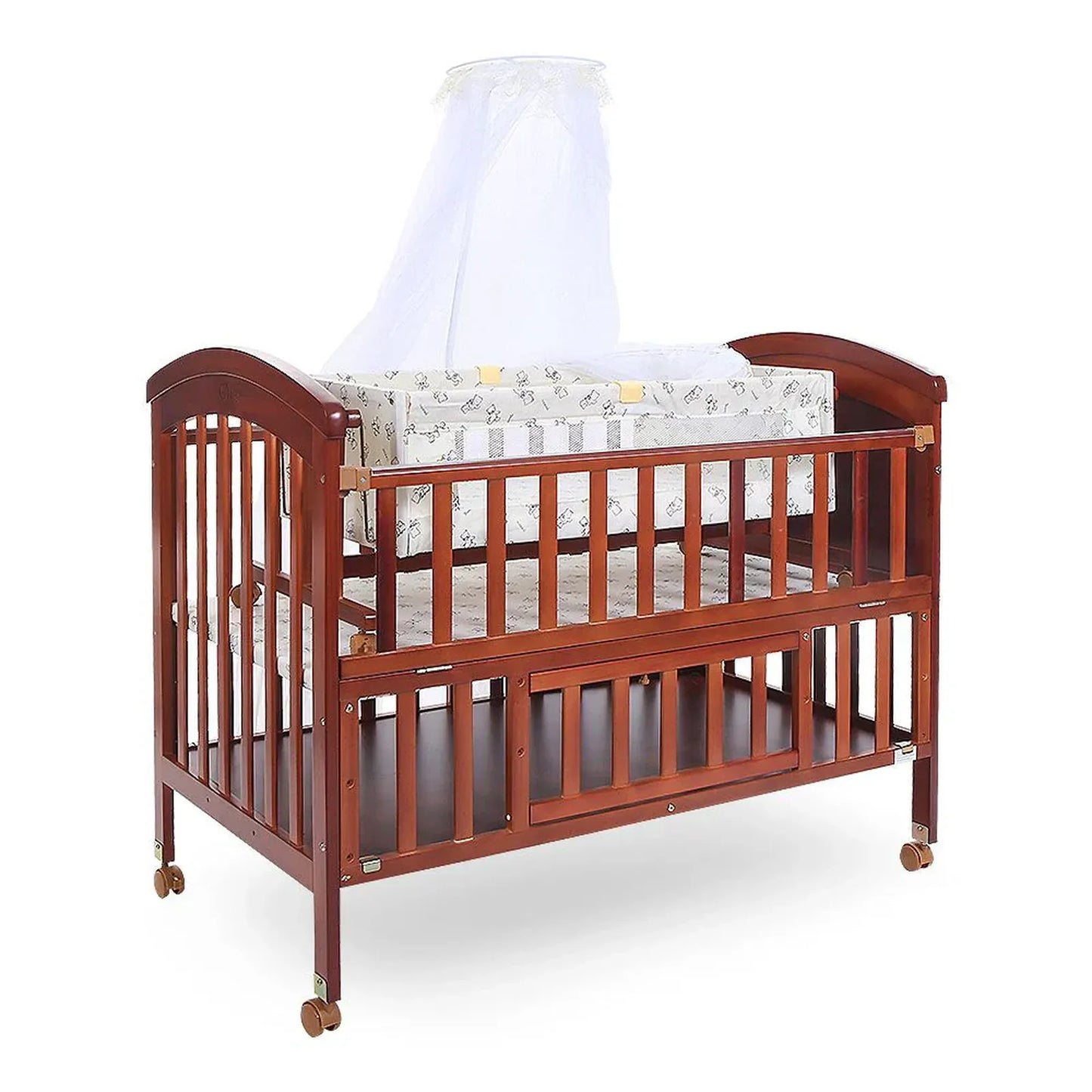 Wooden crib with mattress and canopy on a white background