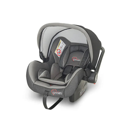 Gray baby car seat with 'inniies' branding on a white background