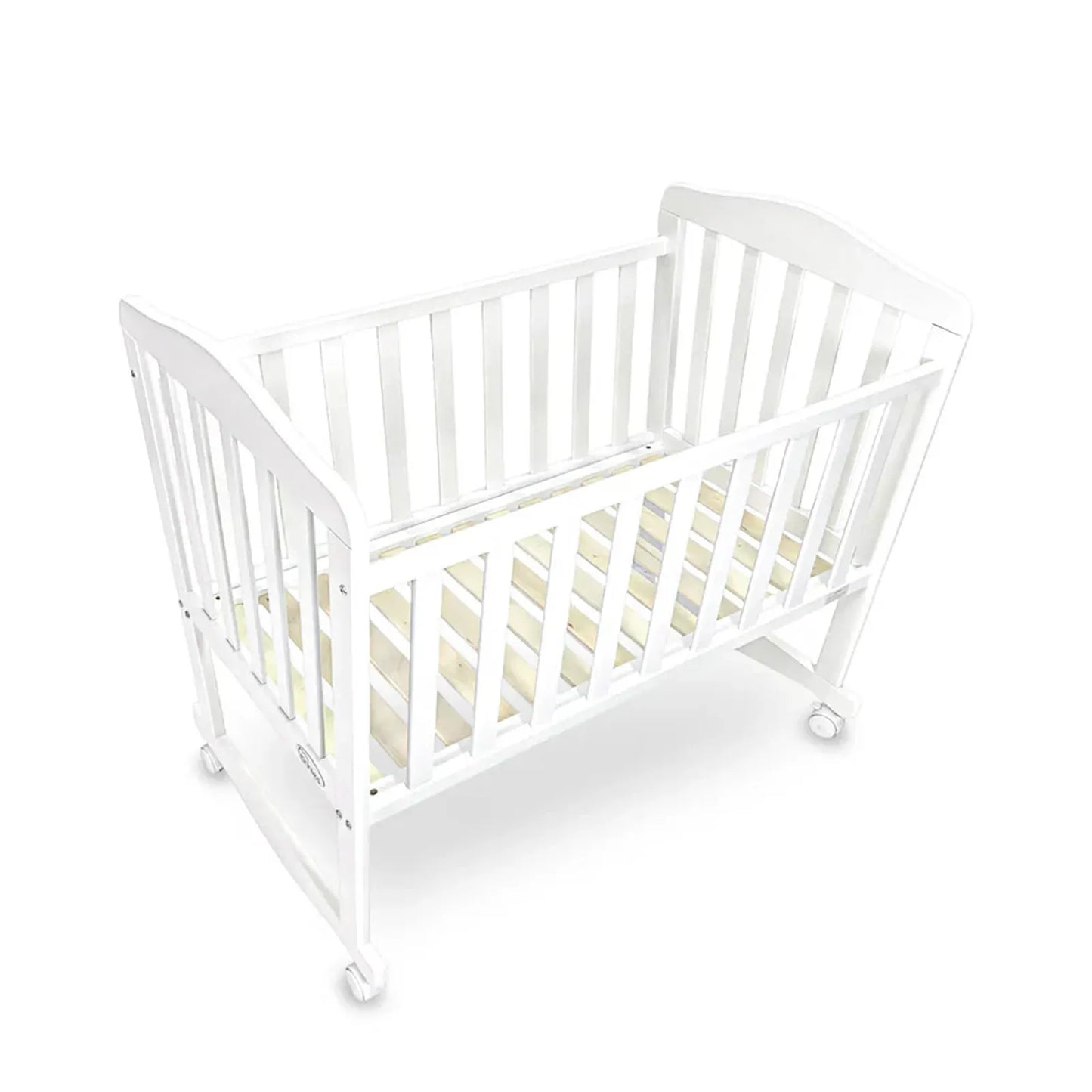 White crib with beige mattress on a white background
