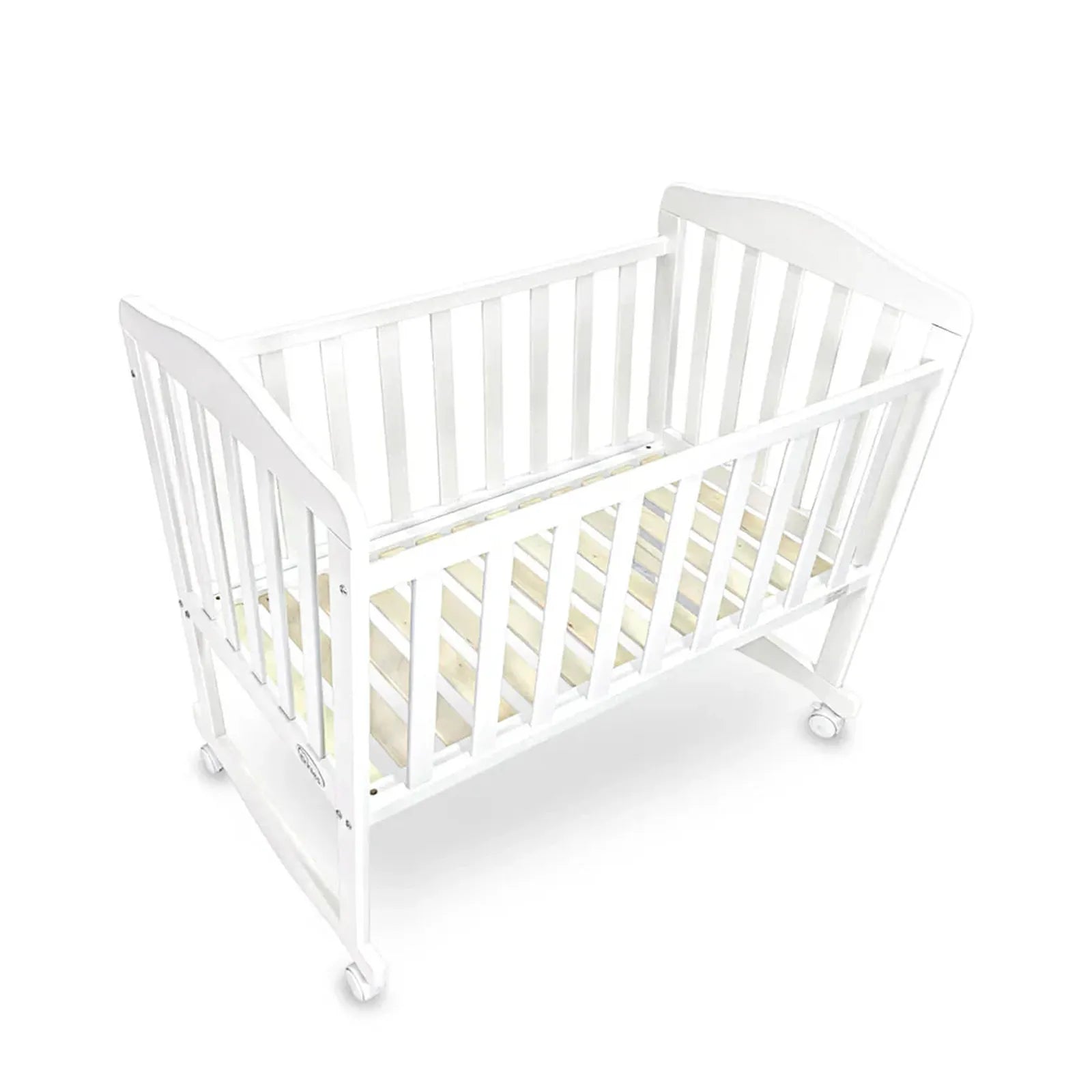 White crib with beige mattress on a white background