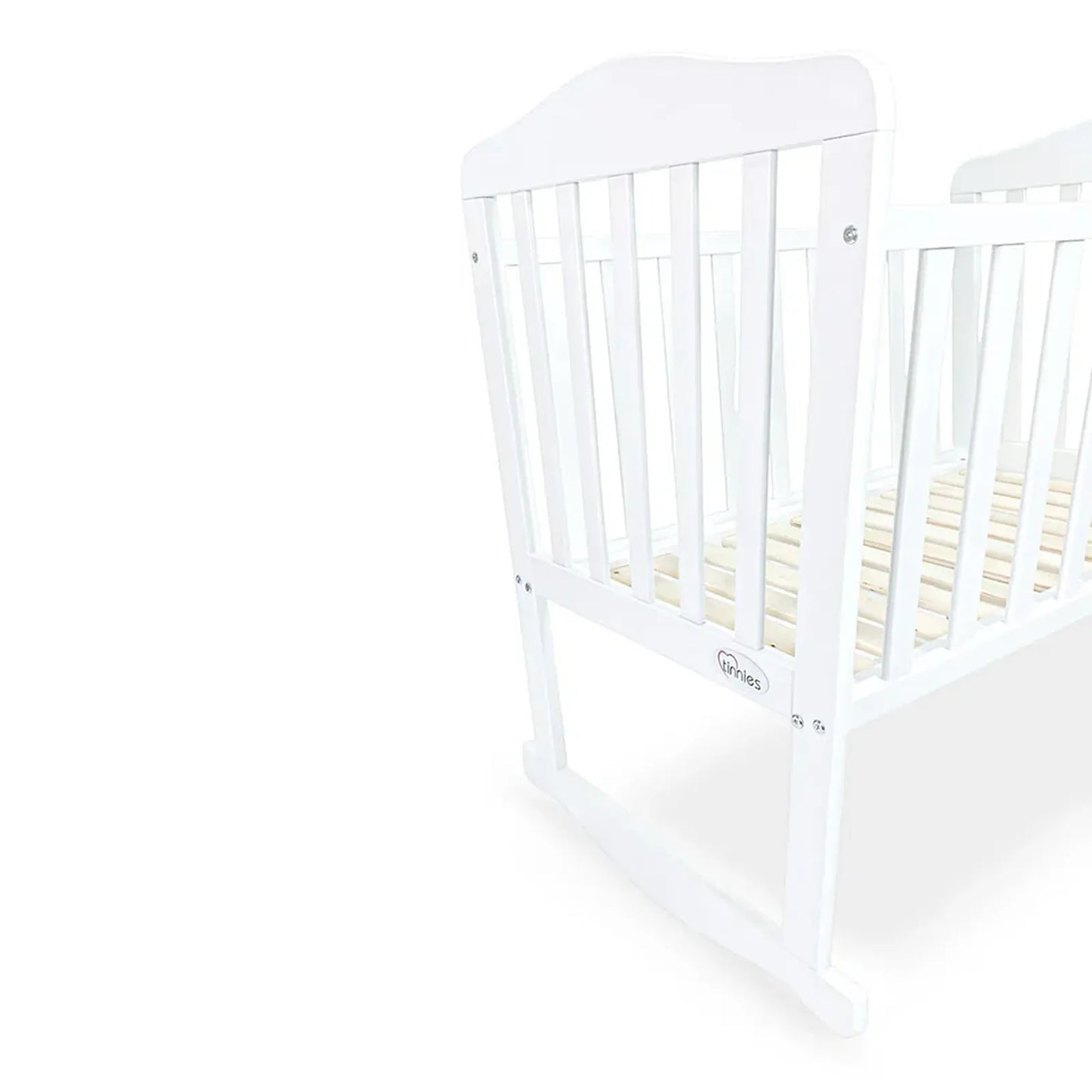 White crib with wooden slats on a white background