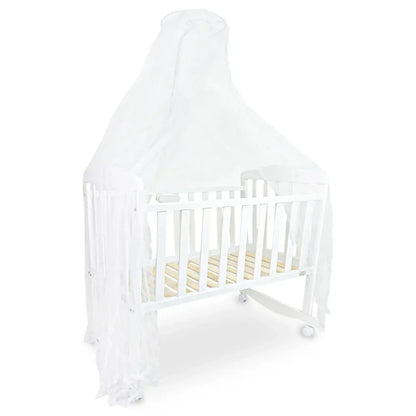 White crib with white mattress on a white background