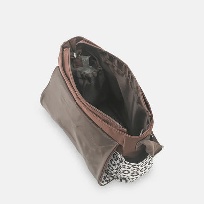 Brown leather pouch with a patterned interior on a white background