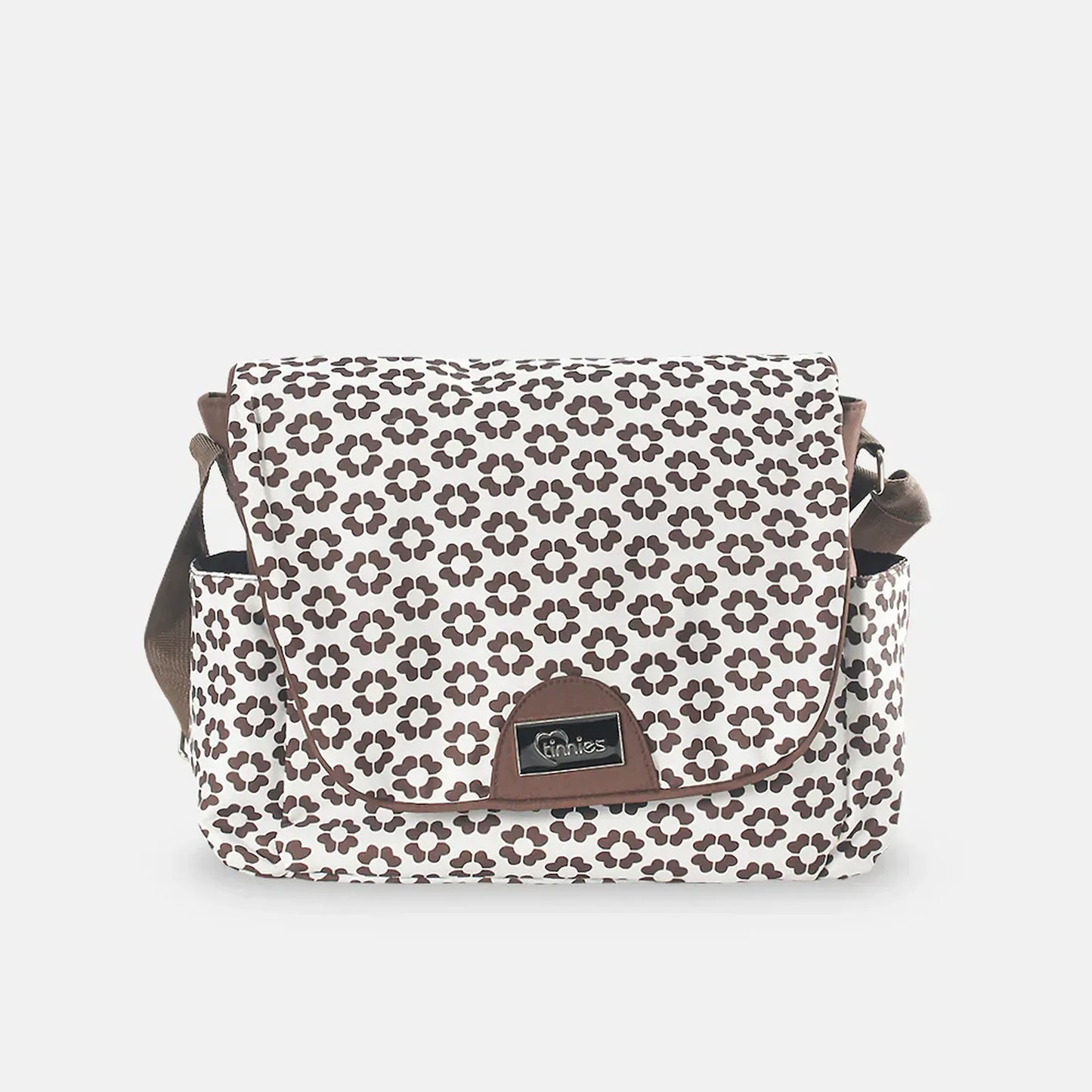 Floral patterned bag with brown accents on a light gray background