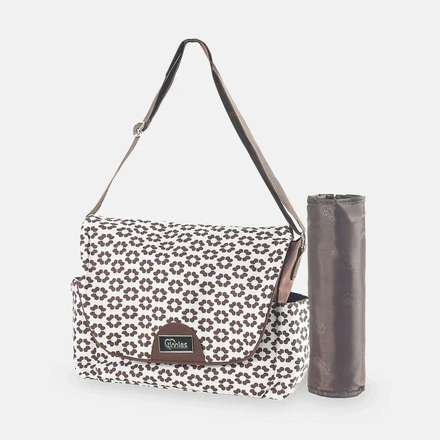 Floral-patterned bag with a matching mat on a white background