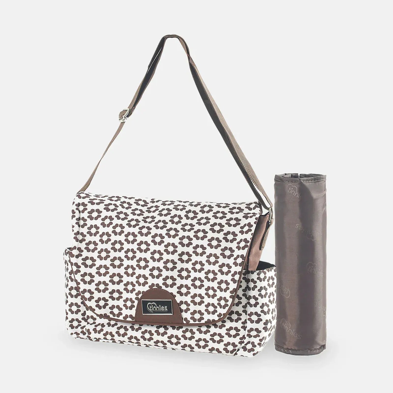 Floral-patterned bag with a matching mat on a white background