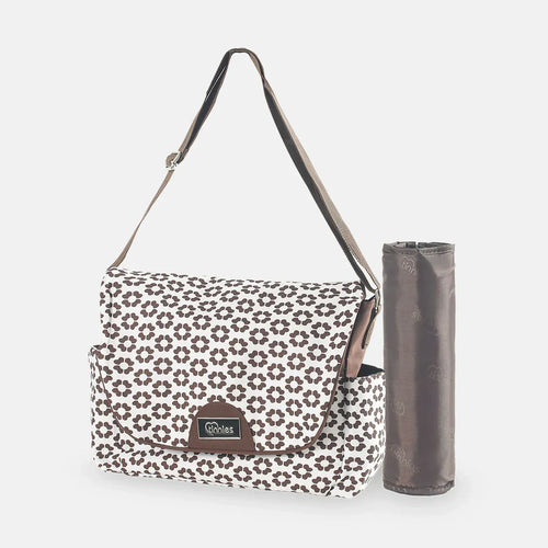 Floral-patterned bag with a matching mat on a white background