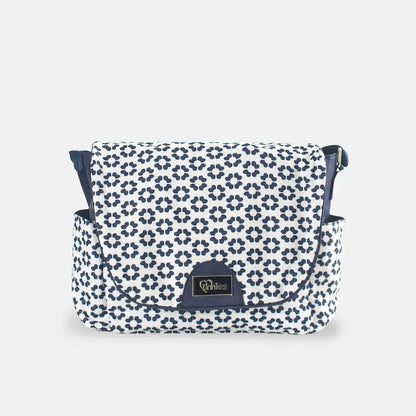 Patterned bag with a visible brand logo on a light gray background
