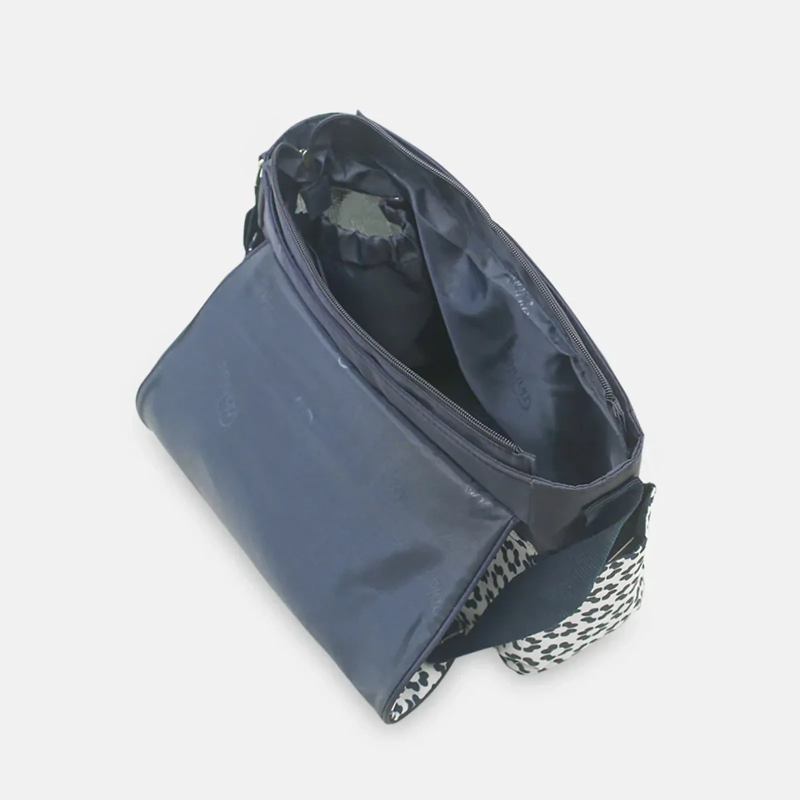 Blue cosmetic bag with a patterned bottom on a light gray background