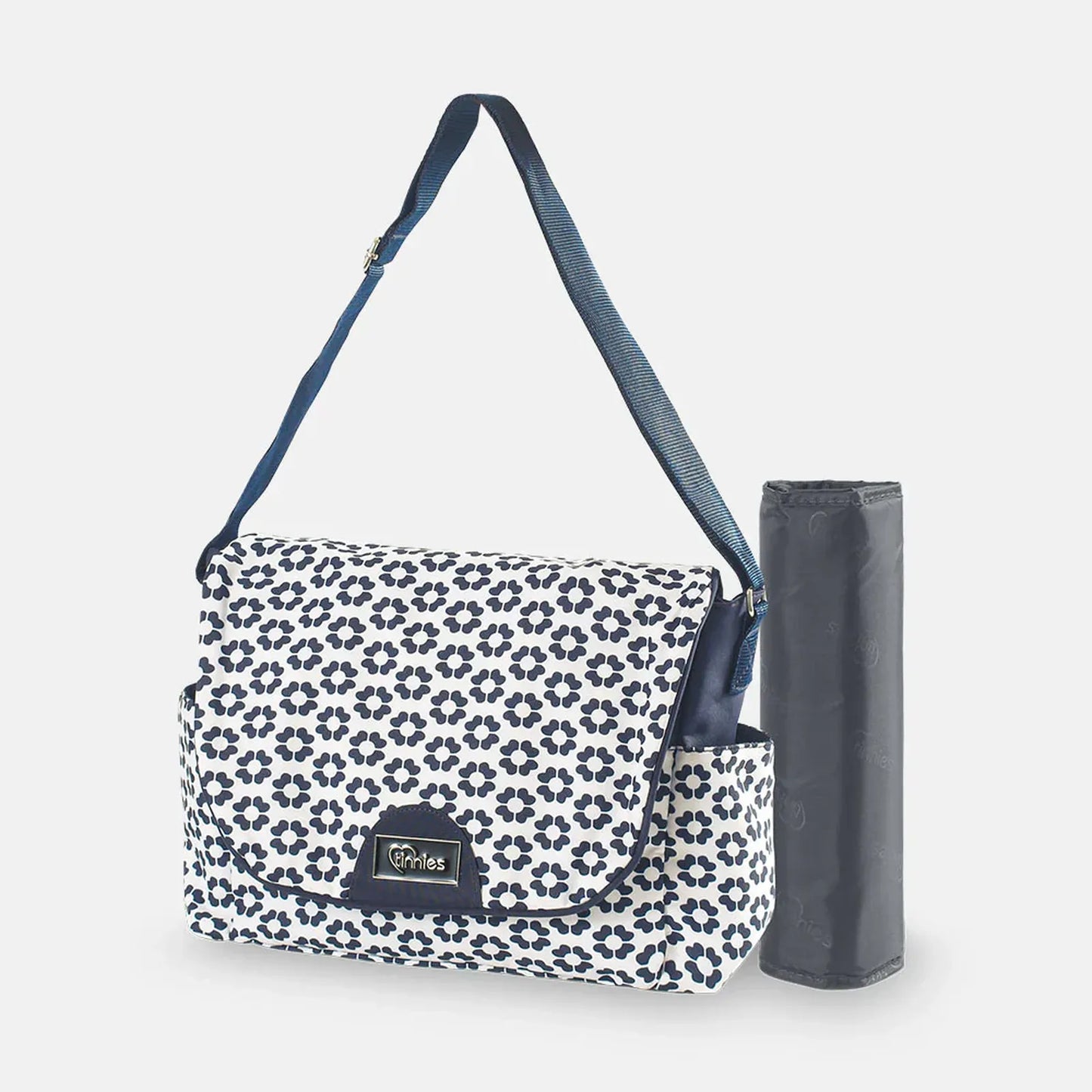 Floral-patterned diaper bag with a matching umbrella on a white background