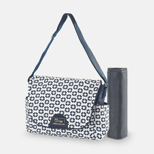 Floral-patterned diaper bag with a matching umbrella on a white background