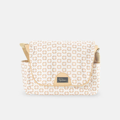 Patterned bag with gold accents on a light gray background