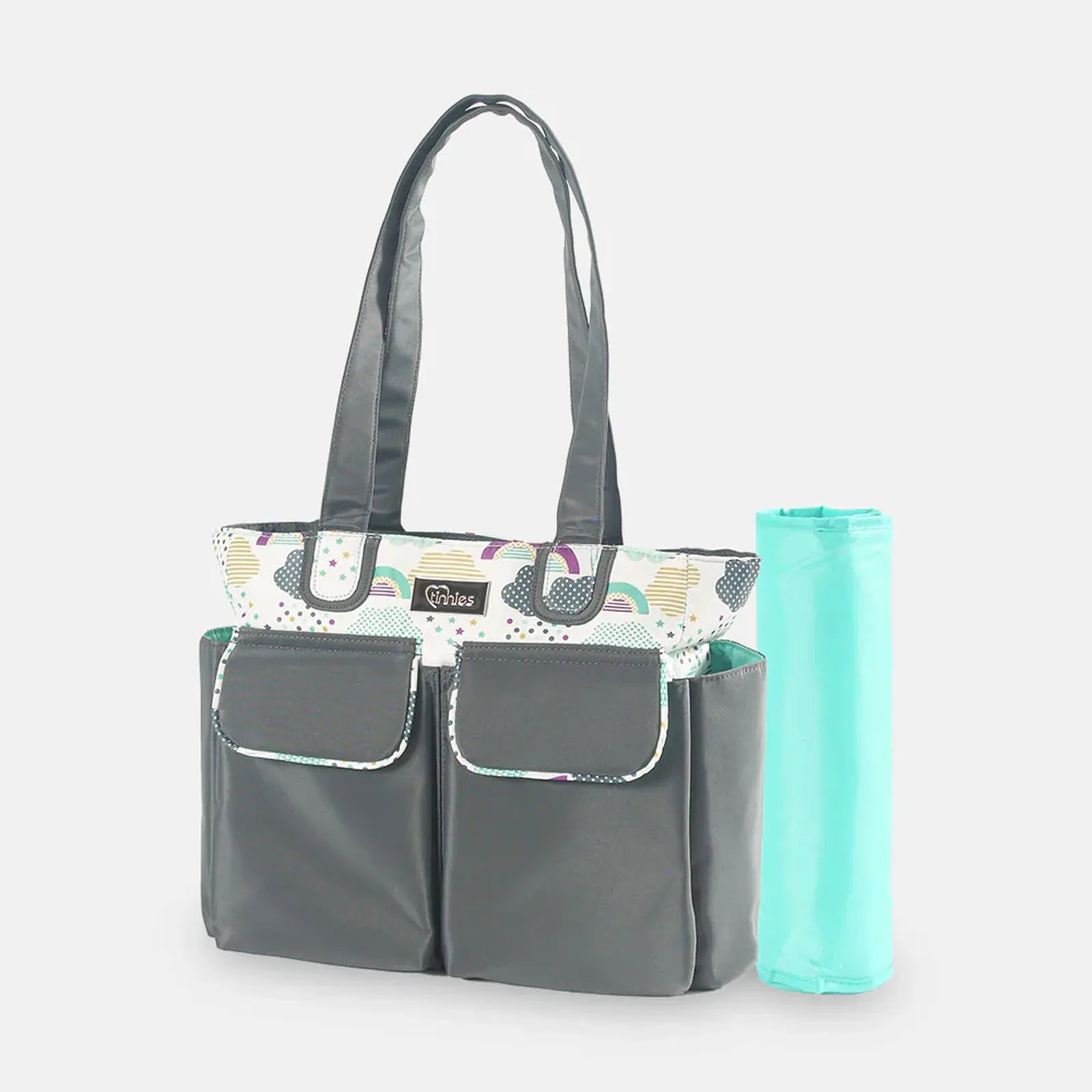 Gray tote bag with colorful top pocket and mint green rolled-up mat on a light gray background