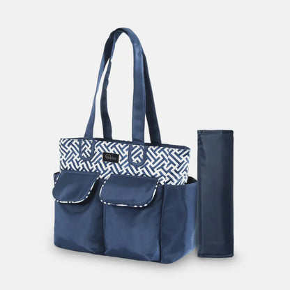 Navy blue diaper bag with geometric patterned insert on a light gray background
