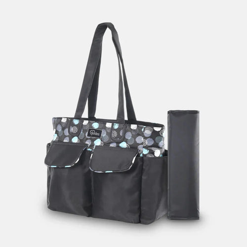 Black diaper bag with patterned top section and matching umbrella on a light gray background