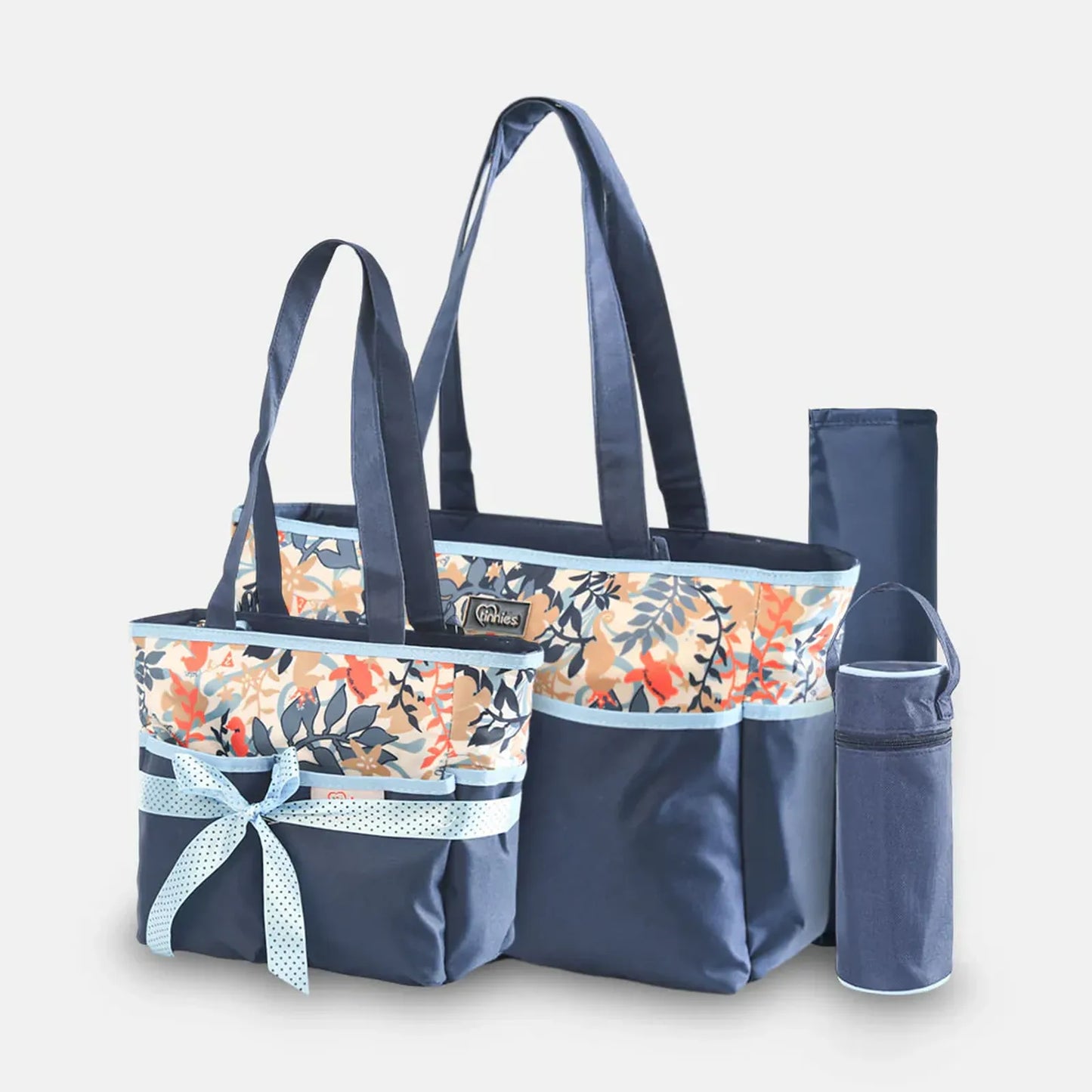 Navy blue tote bag with floral pattern and matching pouch on a light gray background