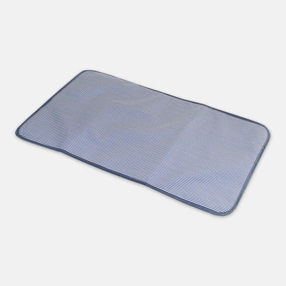 Rectangular blue and white striped placemat on a light gray background