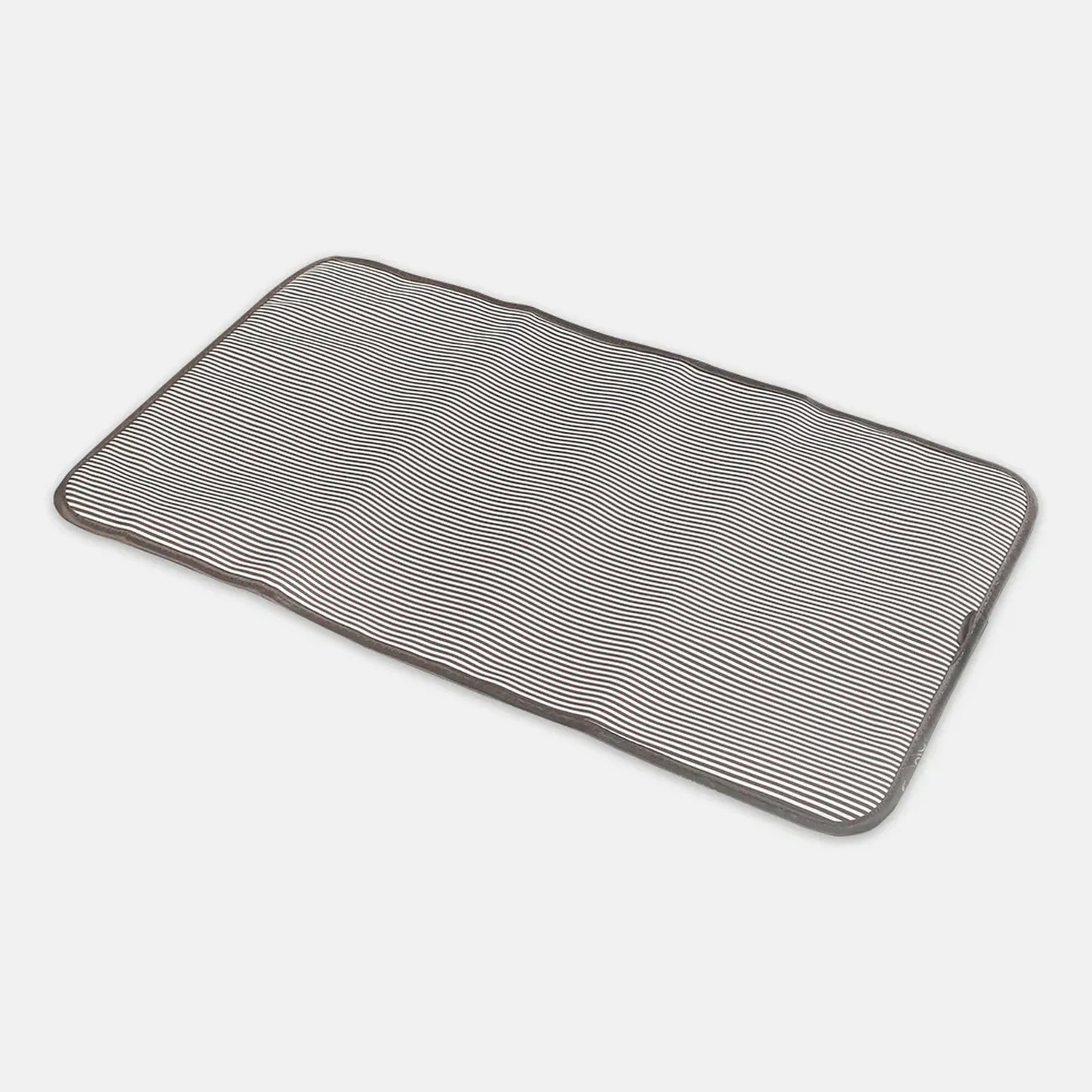 Rectangular bath mat with textured pattern on a white background