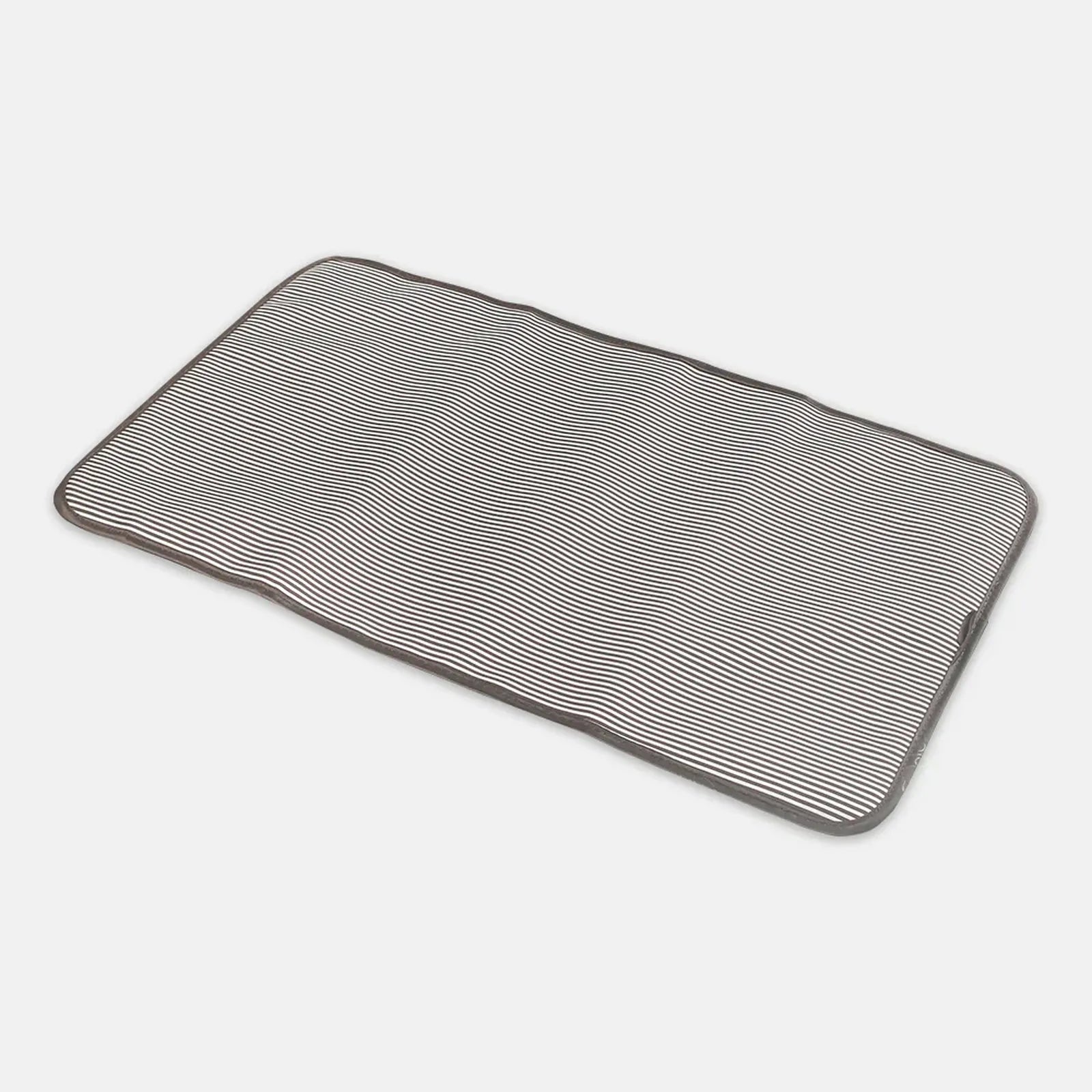 Rectangular bath mat with textured pattern on a white background
