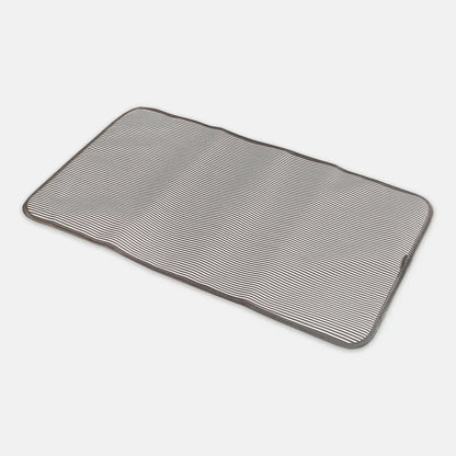 Rectangular bath mat with textured pattern on a white background