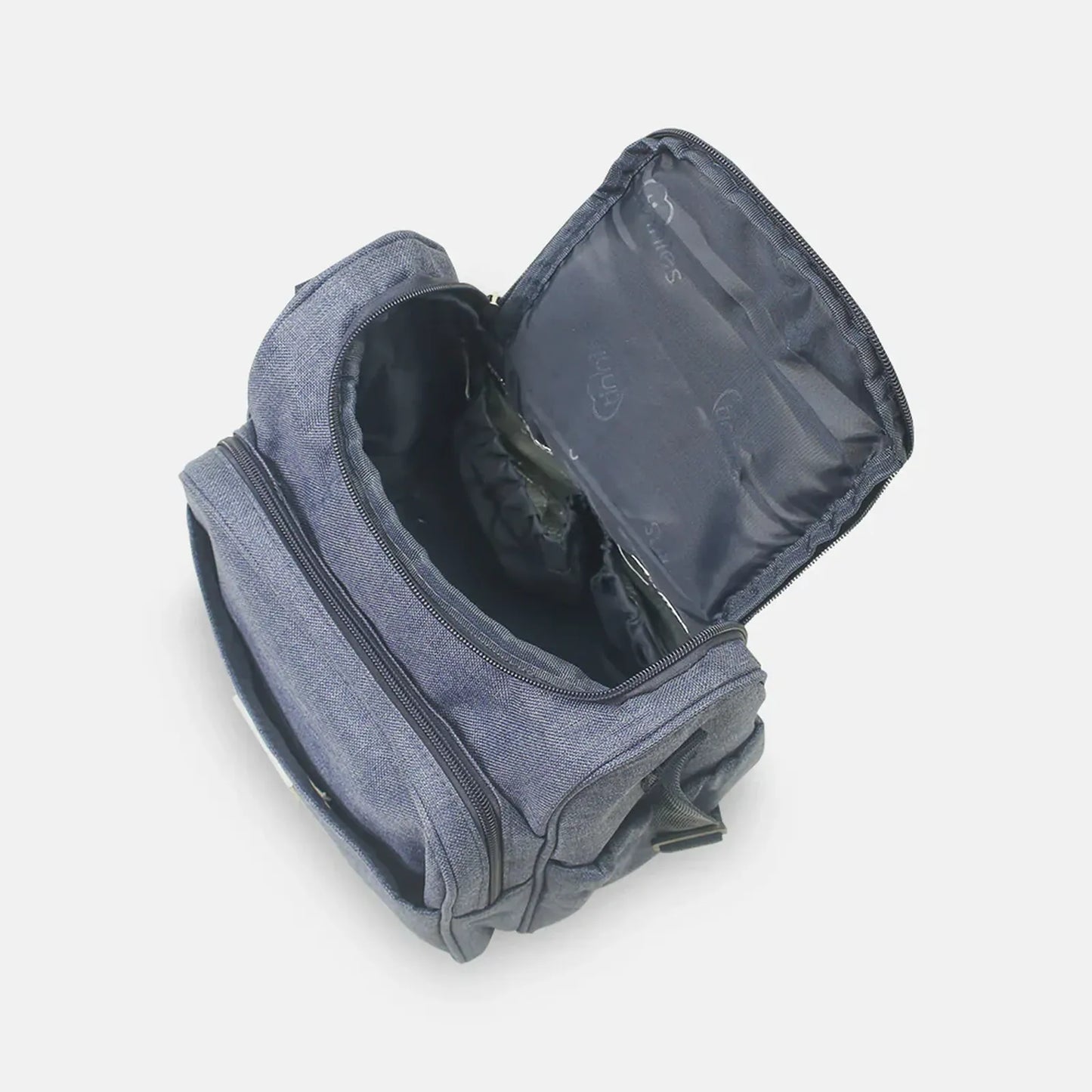 Gray toiletry bag with open compartment on a light gray background
