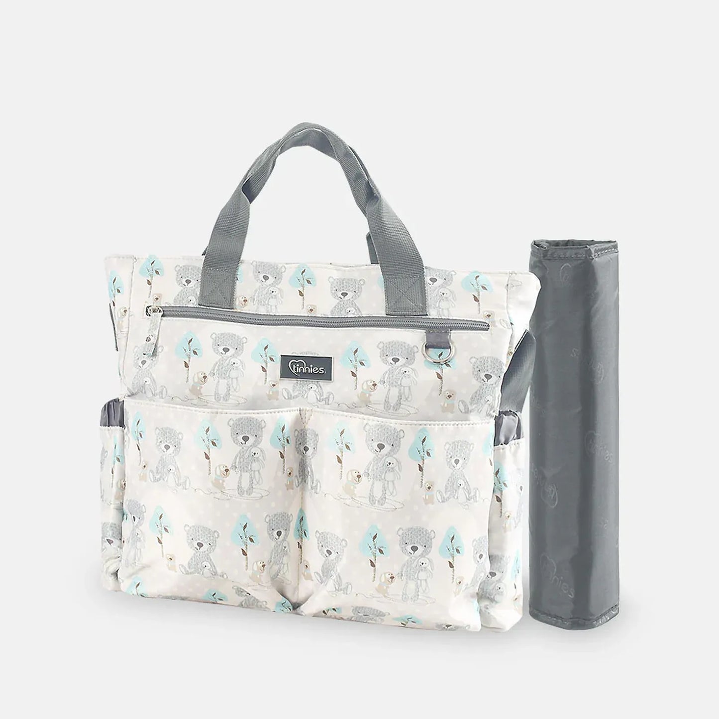 Patterned diaper bag with a gray strap on a white background