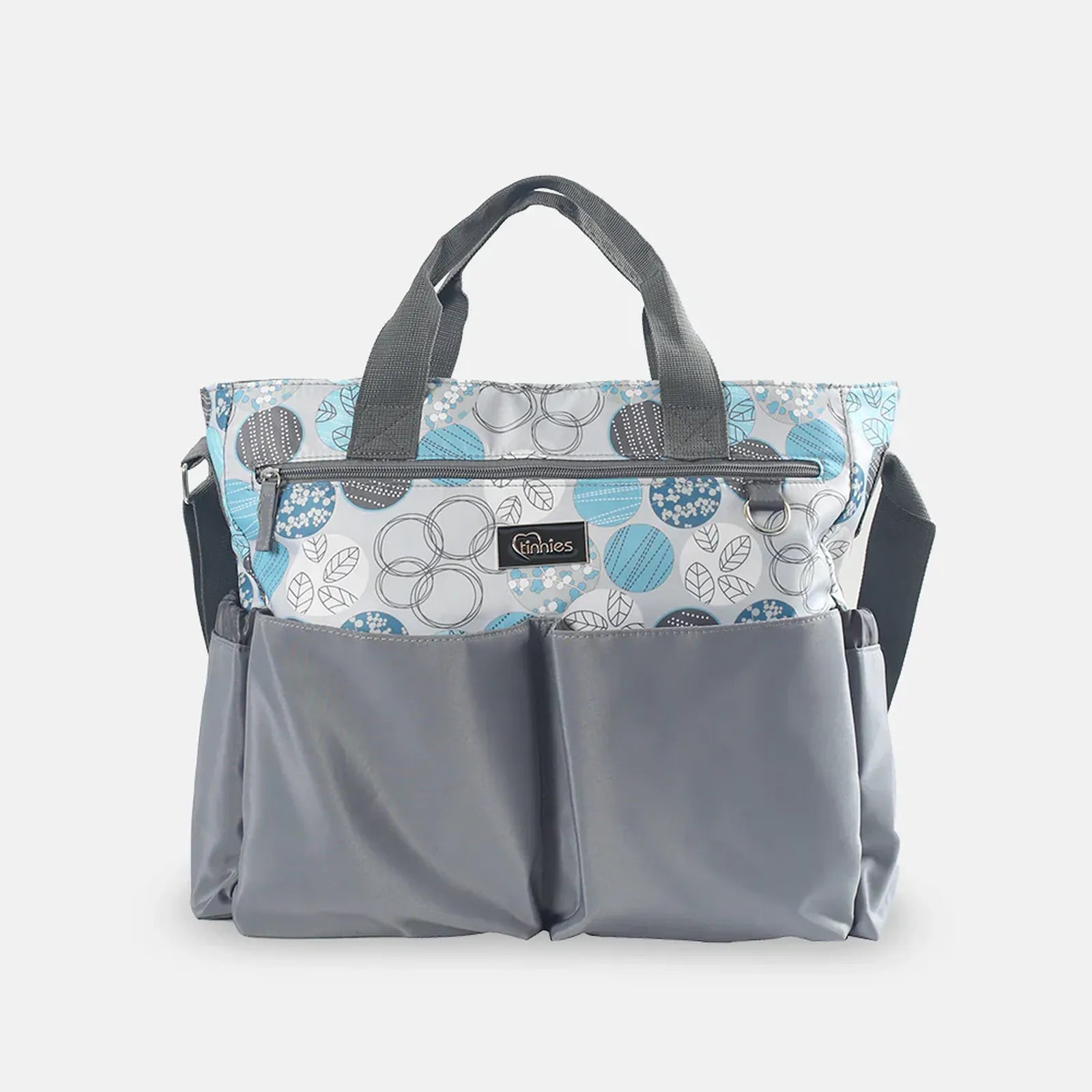 Gray diaper bag with floral patterned top section on a white background