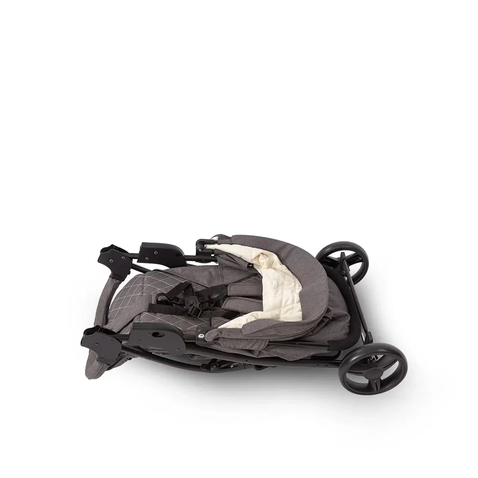 Folded baby stroller on a white background