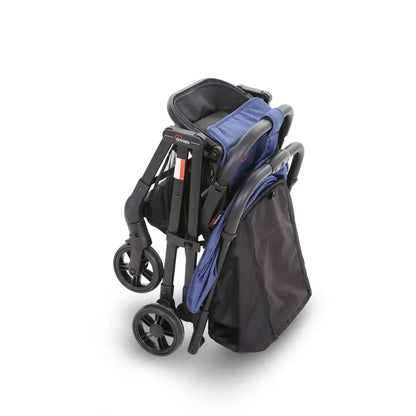 Compact black stroller with blue seat cover on a white background