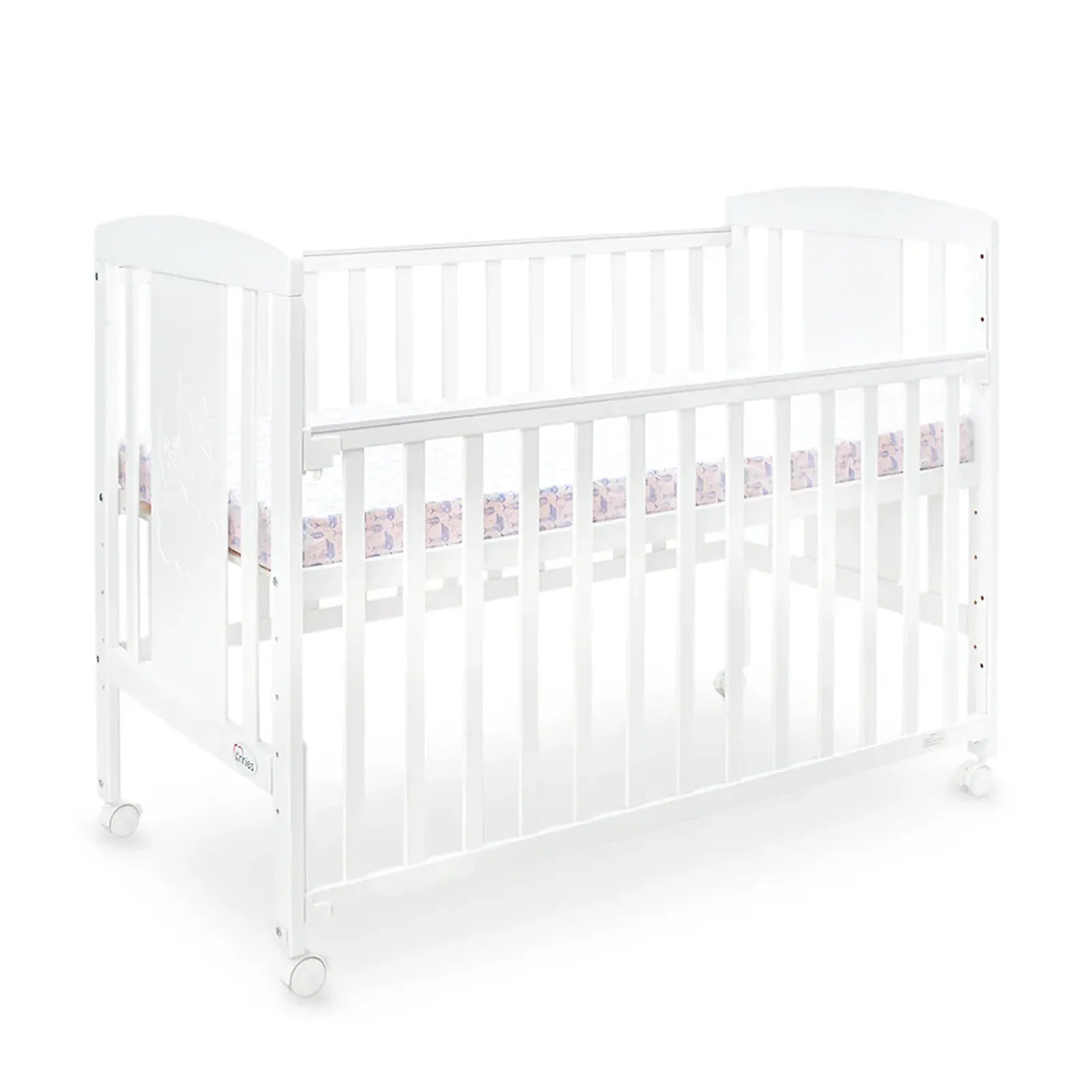 White crib with pink and purple bedding on a white background