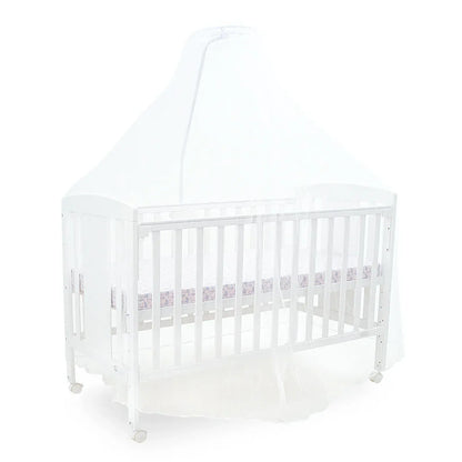 White crib with a white mattress on a white background