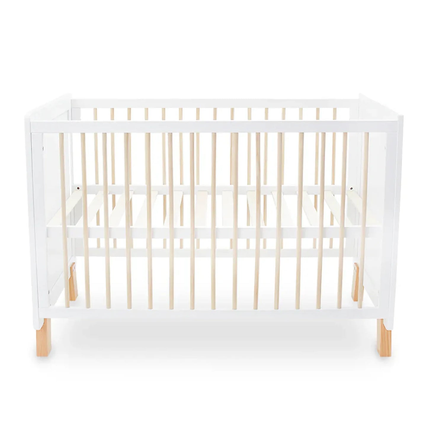 White crib with wooden legs and sides on a white background
