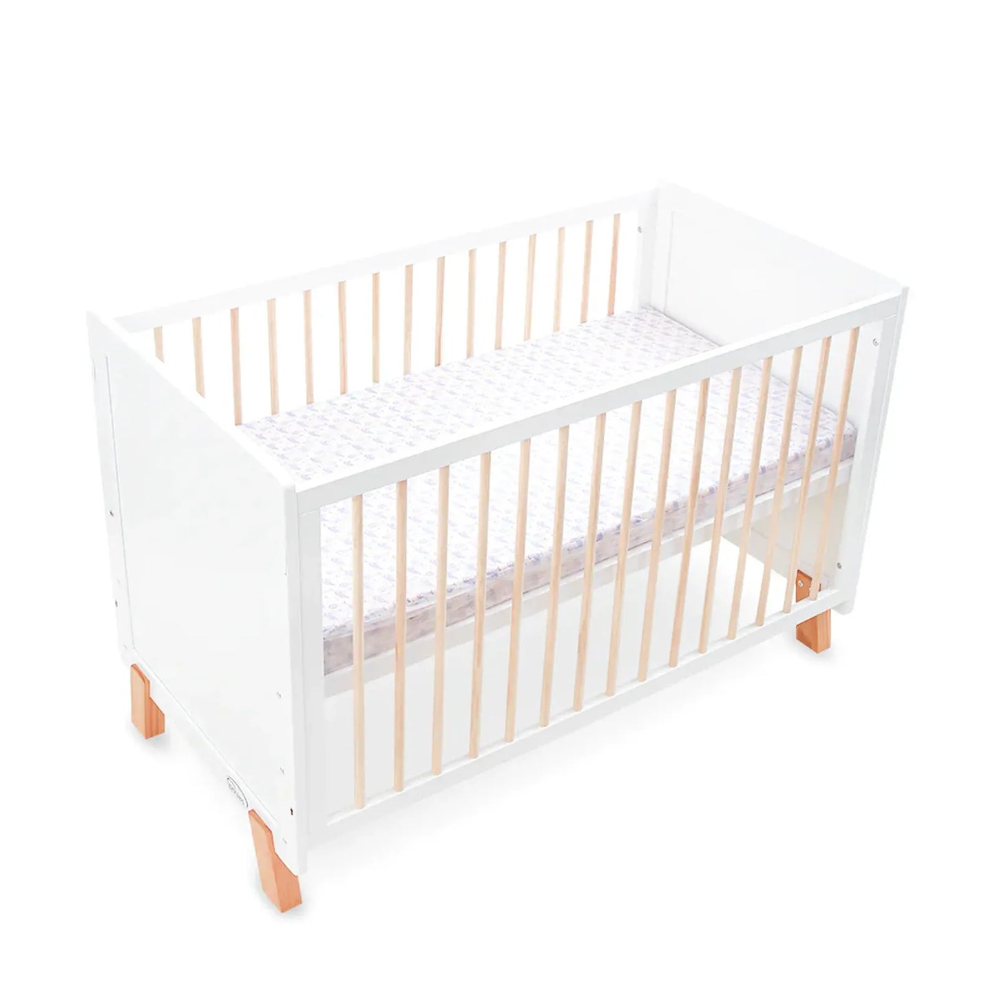 White crib with wooden slats on a white background