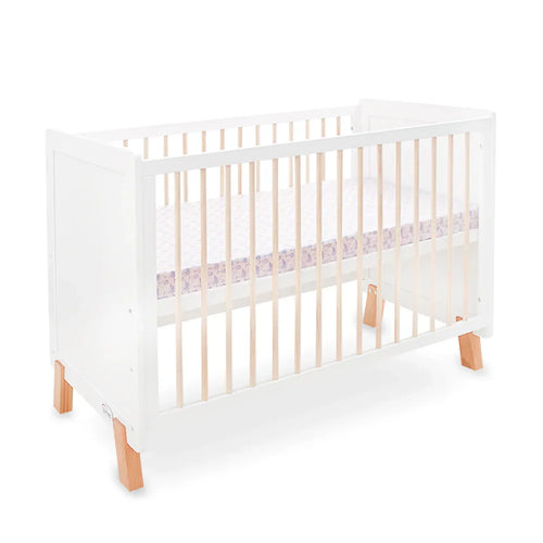 White crib with wooden legs on a white background
