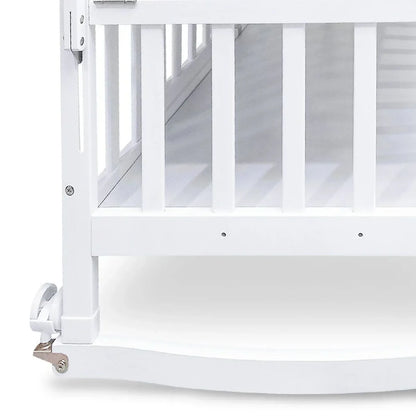White crib with a mesh side panel on a white background